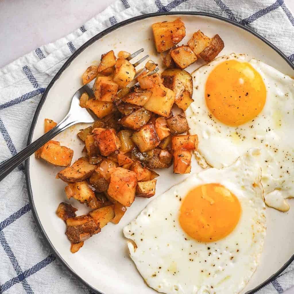 Cheater Home Fries on Plate with Eggs