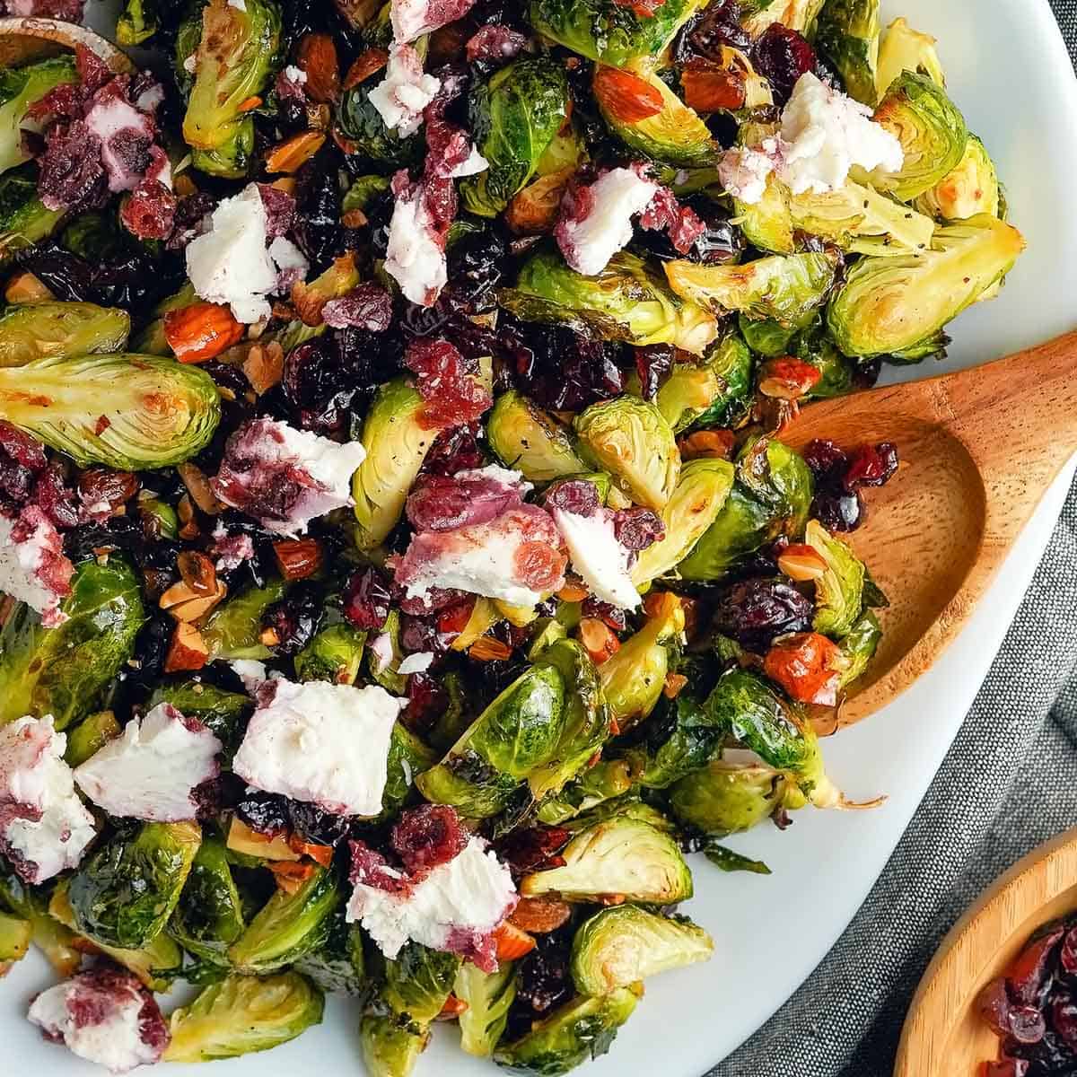Brussels sprouts cheese and nuts in white bowl