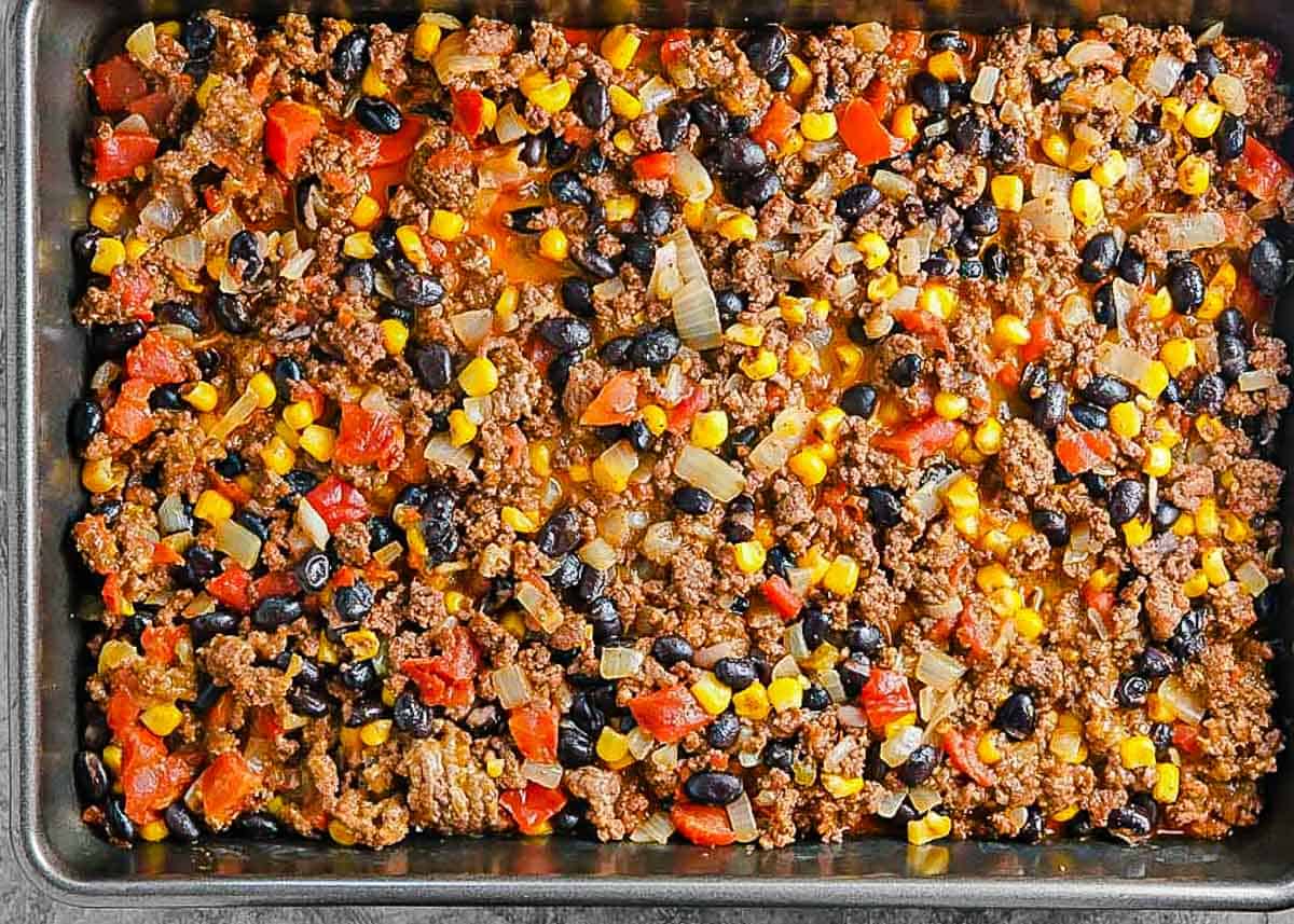chili spread in bottom of baking pan