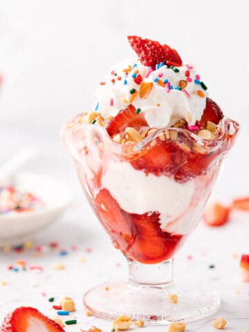 strawberry sundaes with sprinkles on the side