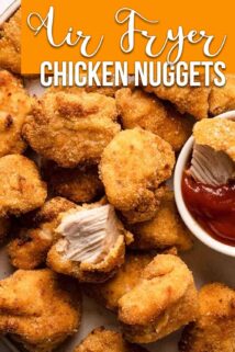 chicken nuggets piled together with one nugget torn in half on the top and ketchup on the side with text box at top