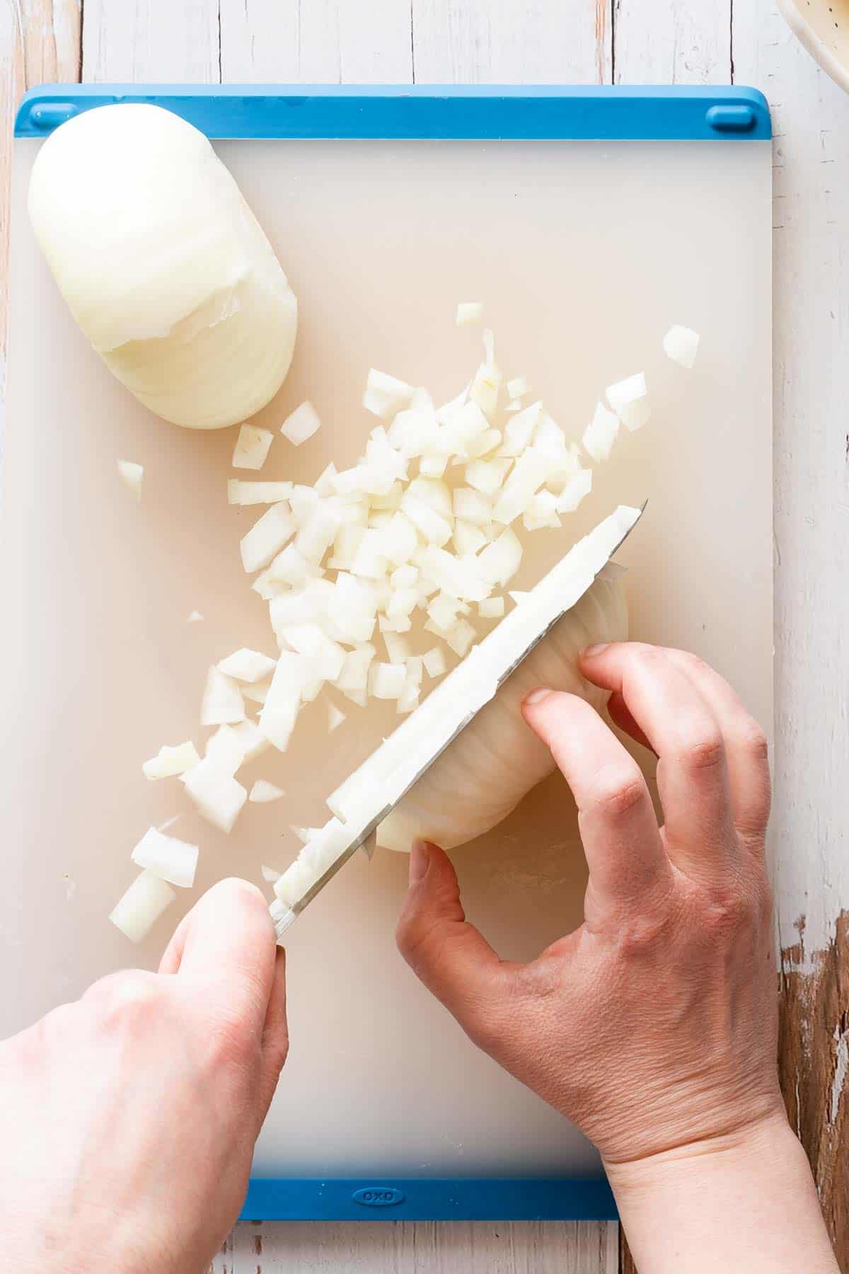 onion being diced on cutting board.