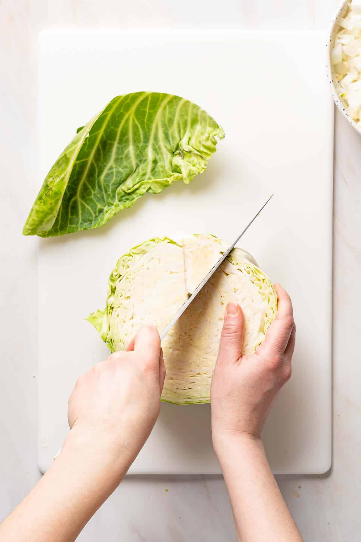 core being cut out of half cabbage.