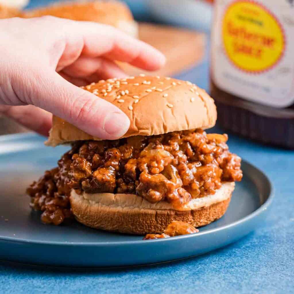 sloppy Joe being assembled on a plate.