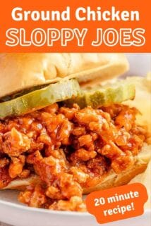 chicken sloppy Joe on plate garnished with pickles with text label at the top.