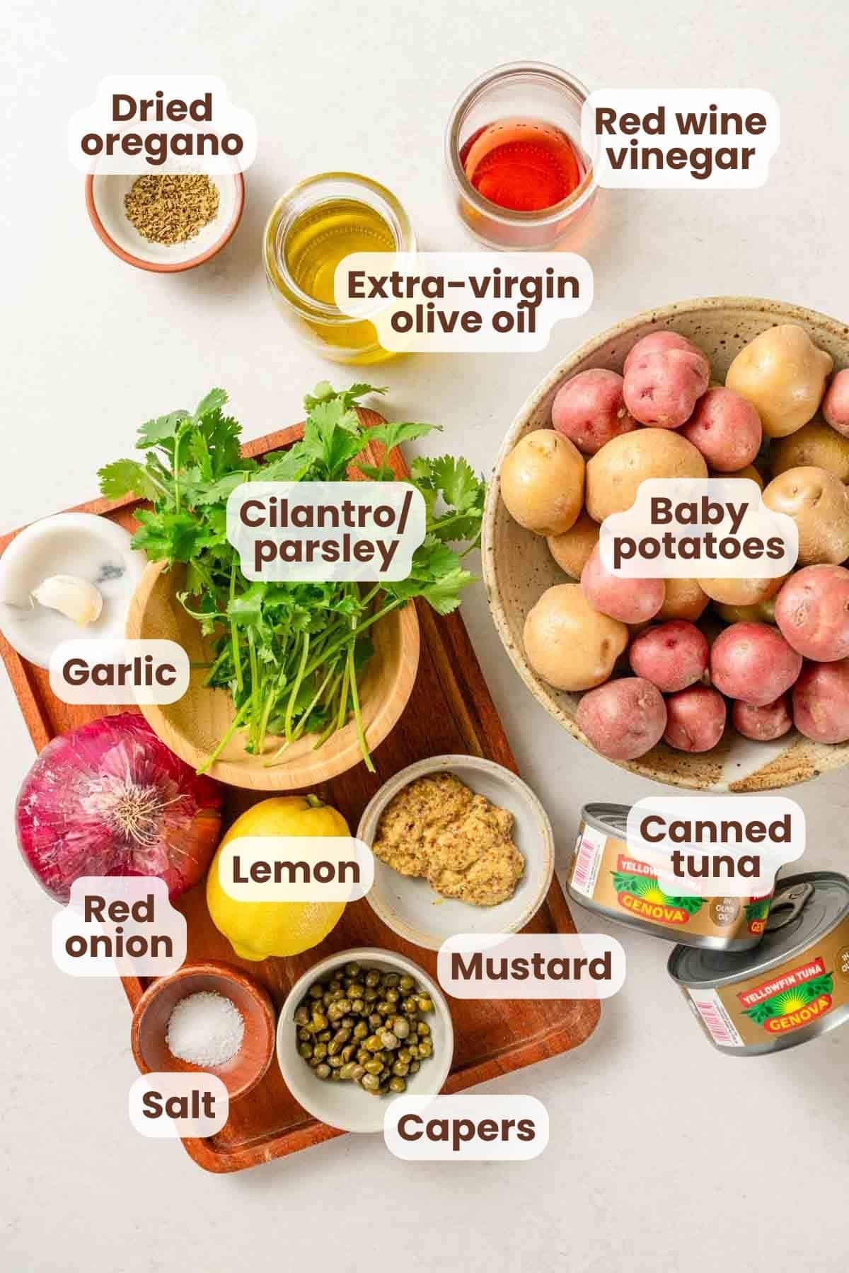 ingredients for tuna potato salad with text labels.