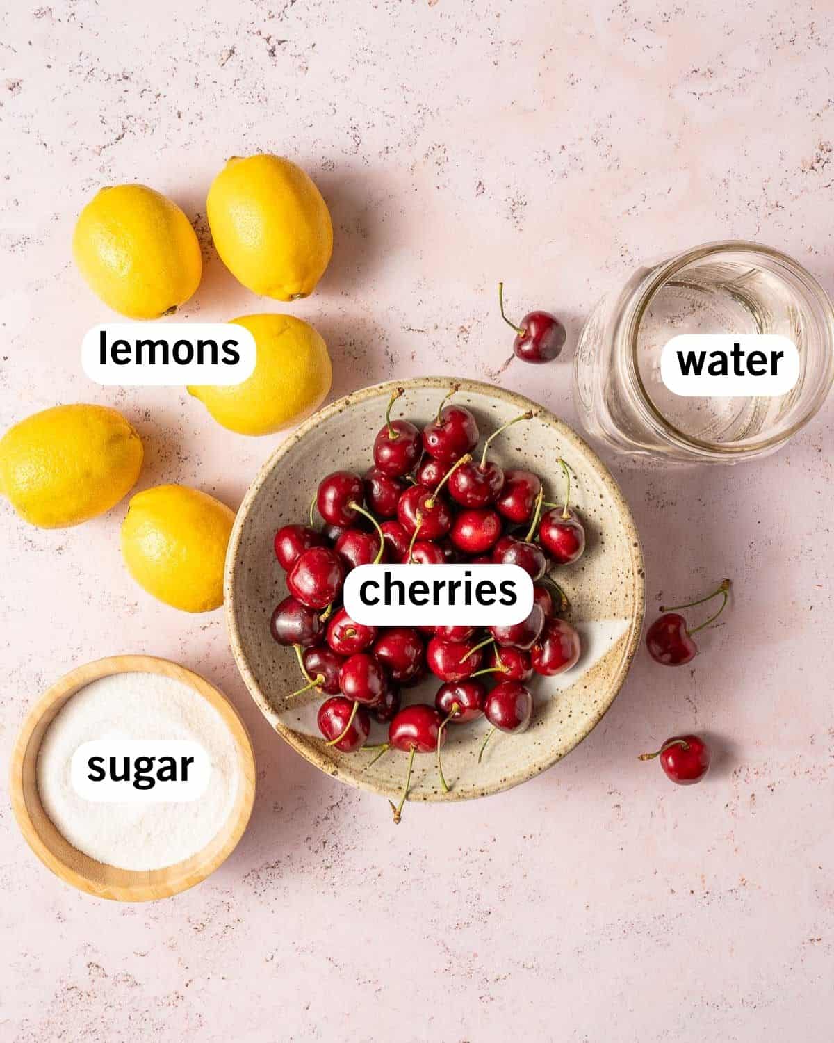 ingredients for cherry lemonade with text labels.