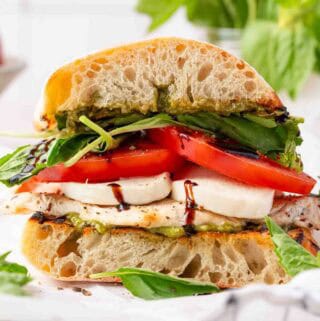 chicken sandwich with basil tomato and mozzarella with balsamic drizzle.