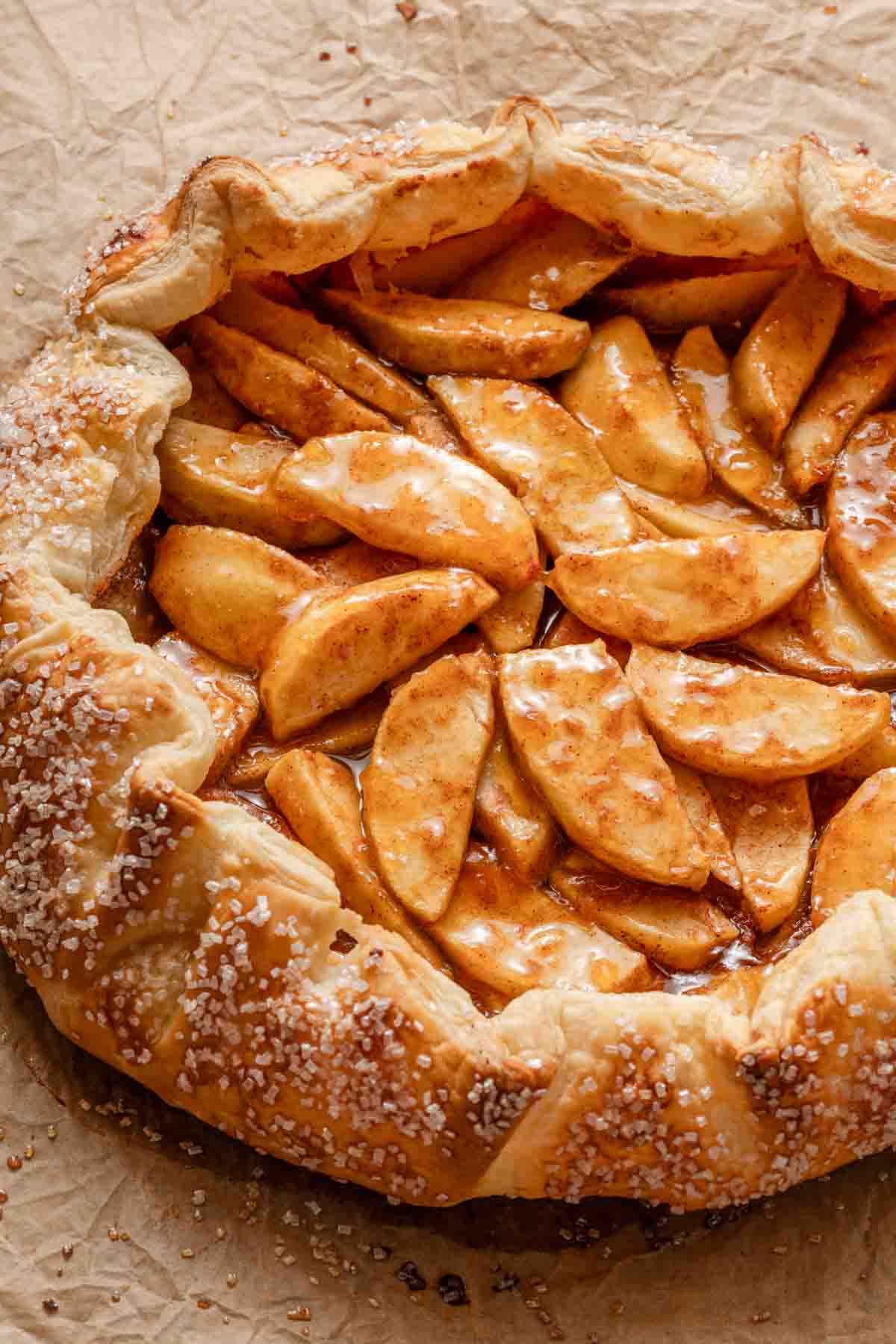 apple galette on brown parchment paper.