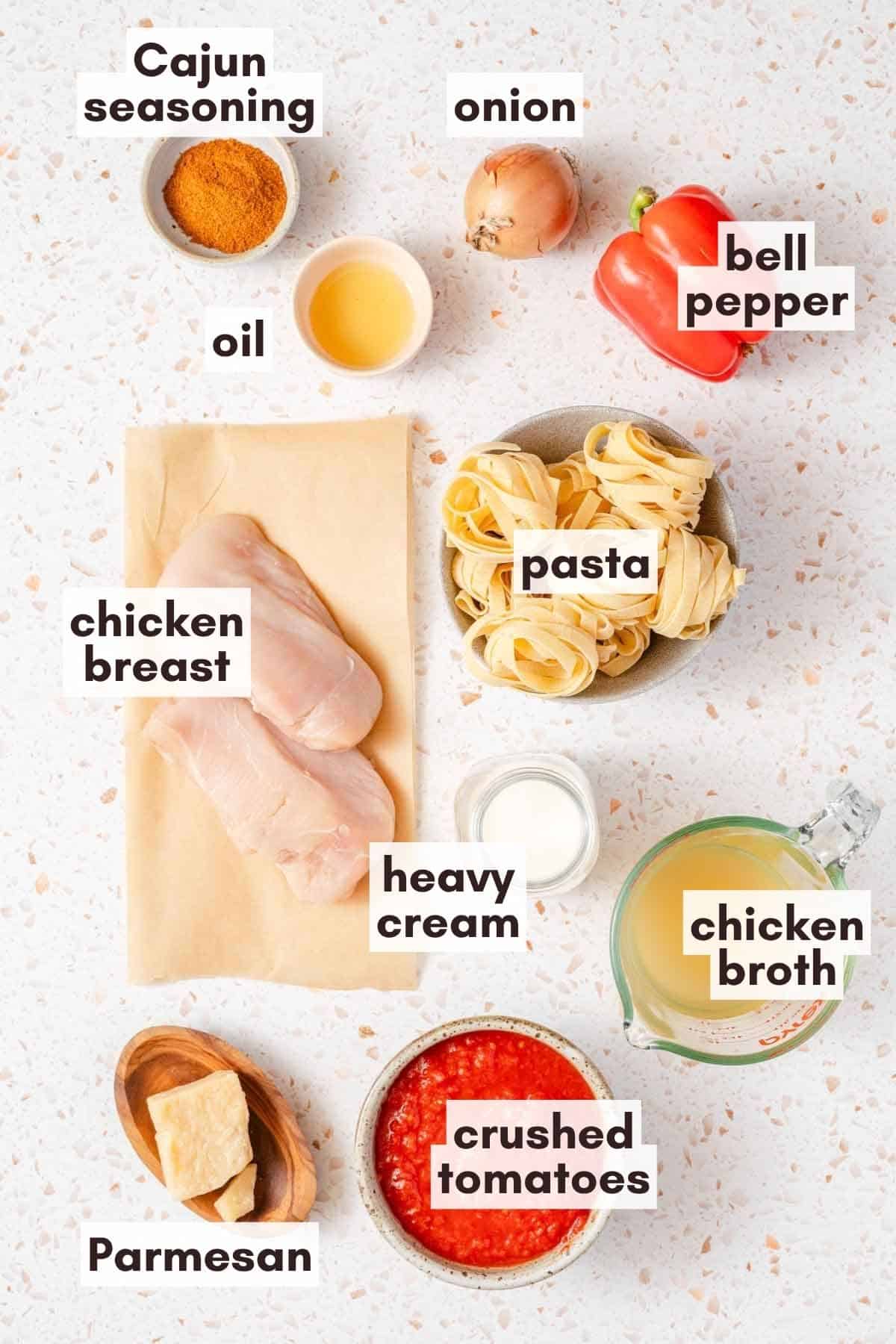 ingredients for the creamy Cajun style pasta with recipe labels.