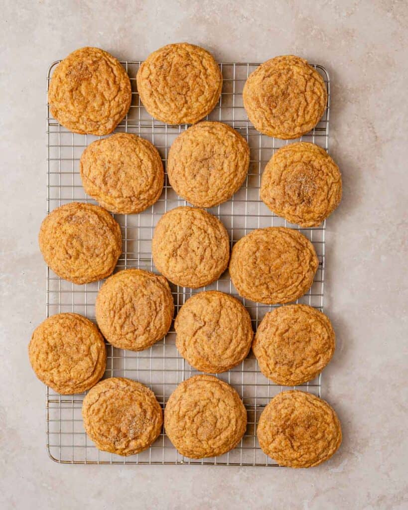 pumpkin cookies on cooling rack.