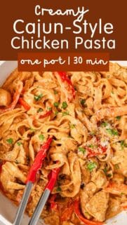 creamy Cajun chicken pasta with tongs and recipe title at the top.